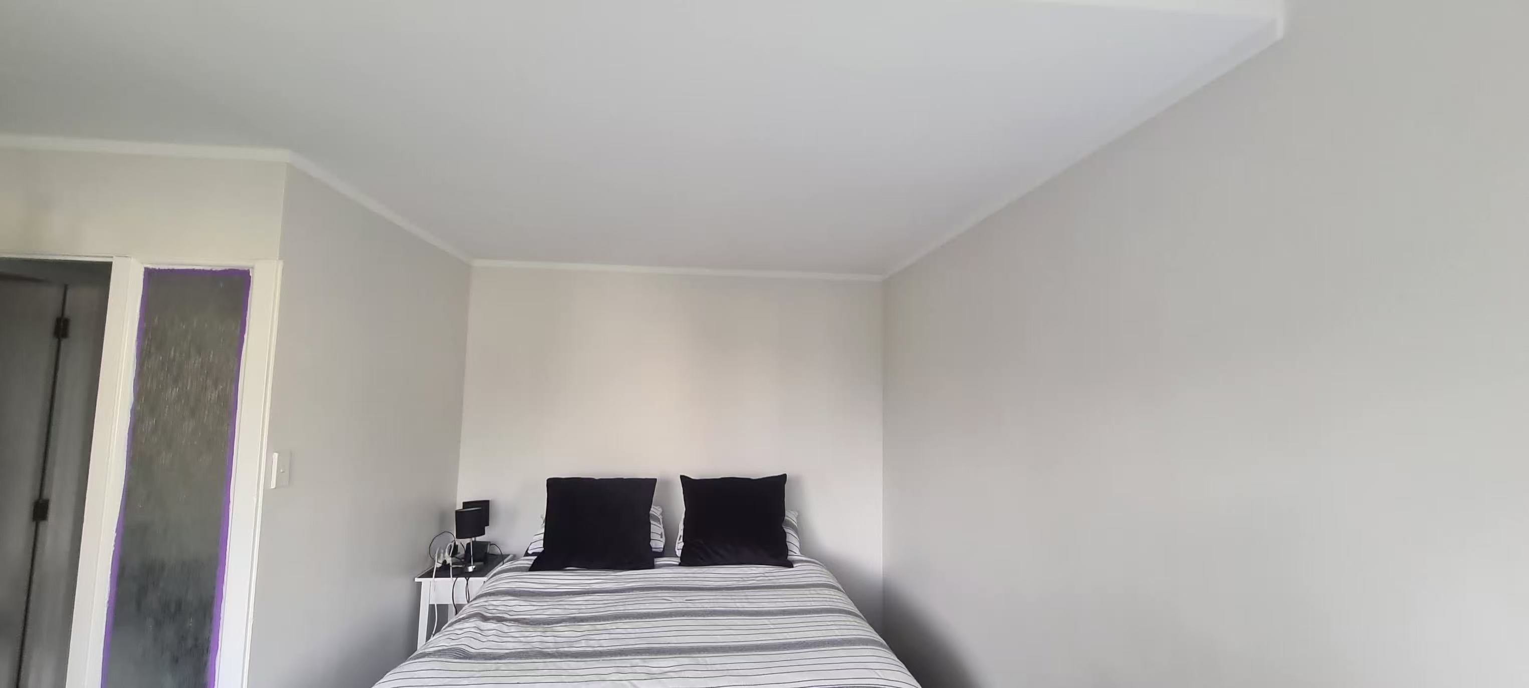 Bedroom interior after repainting in a calm neutral colour
